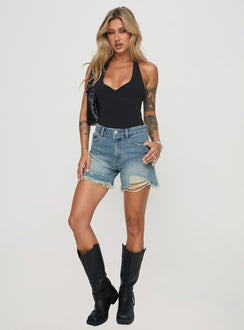 front view of model wearing Princess Polly Tranquility Shorts Light Wash High Waisted Shorts 