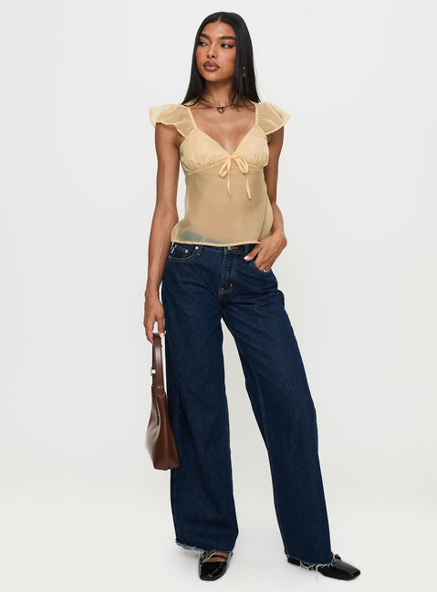 front view of model wearing Princess Polly Keysia Cap Sleeve Sheer Top Apricot Short Sleeves Plunger 