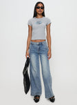 front view of model wearing Princess Polly Skipper Low Rise Baggy Jeans Vintage Blue Low Rise Jeans 