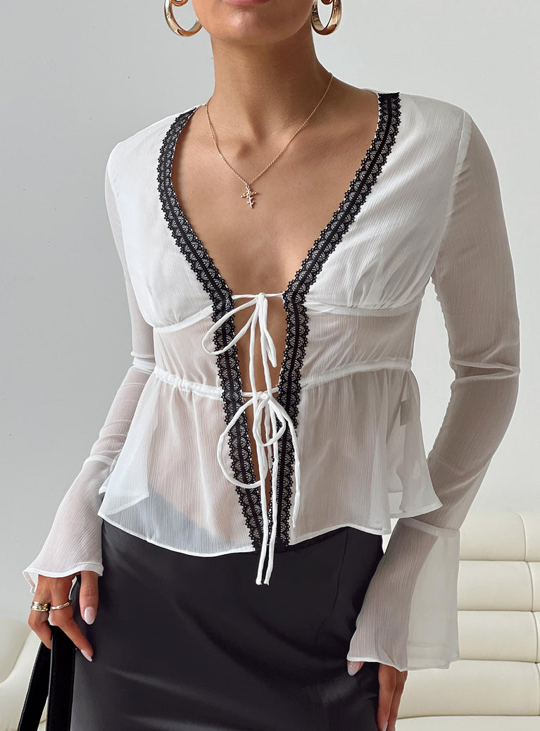 Long sleeve top Sheer material V neckline Lace trim Twin tie fastening at bust