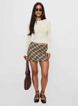   side view of model wearing Princess Polly Point Of View Mini Skirt Brown Check Mini Skirts 