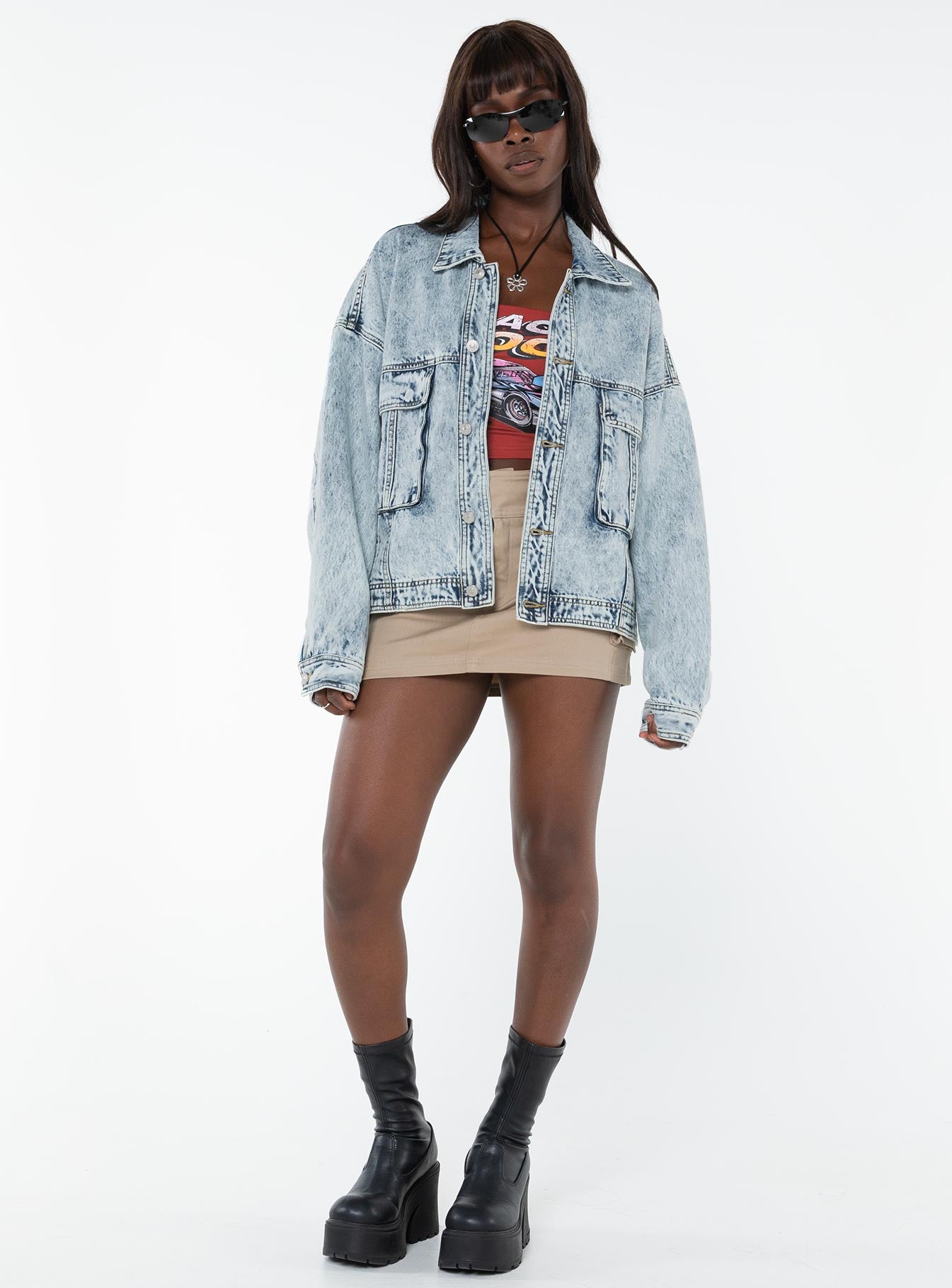 Oversized light wash denim jacket  Classic collar, drop shoulder, button fastening at front, oversized chest pocket, single button cuff