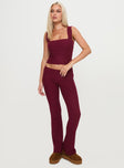 front view of model wearing Princess Polly Closed Eyes Flared Pants Maroon Low Rise Pants 