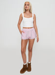 front view of model wearing Princess Polly Orielle Low Rise Boxer Short Pink High Waisted Shorts 