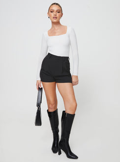 back view of model wearing Princess Polly Seize The Day Shorts Black High Waisted Shorts 