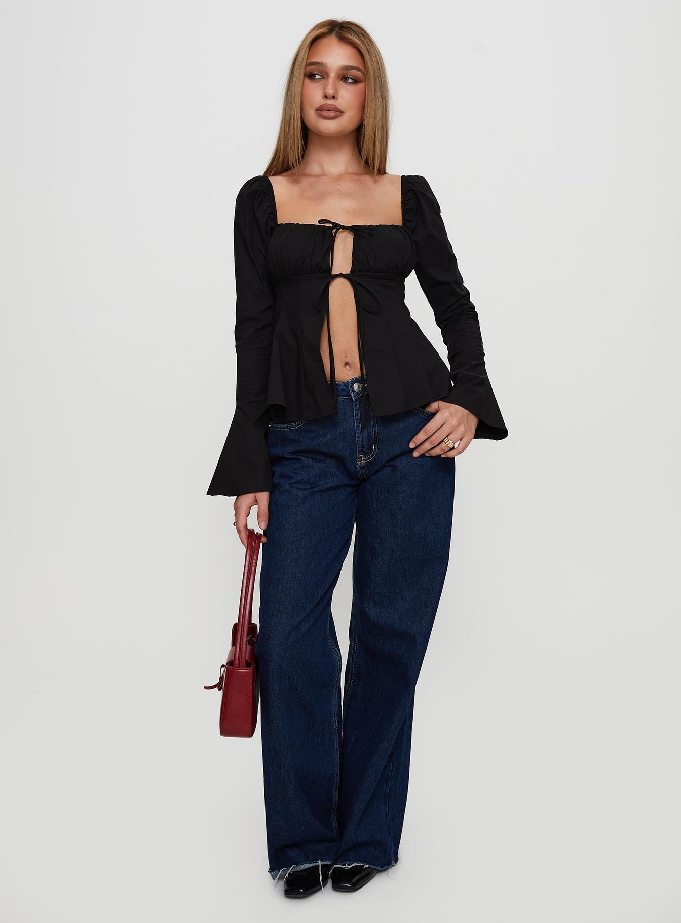 front view of model wearing Princess Polly Lilibette Tie Up Long Sleeve Top Black Full Sleeves Square Neck 