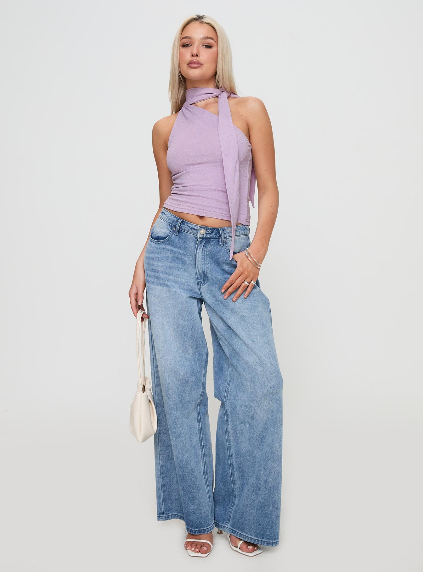 side view of model wearing Princess Polly Anderstone Neck Tie Top Purple Sleeveless Asymmetric Neckline 