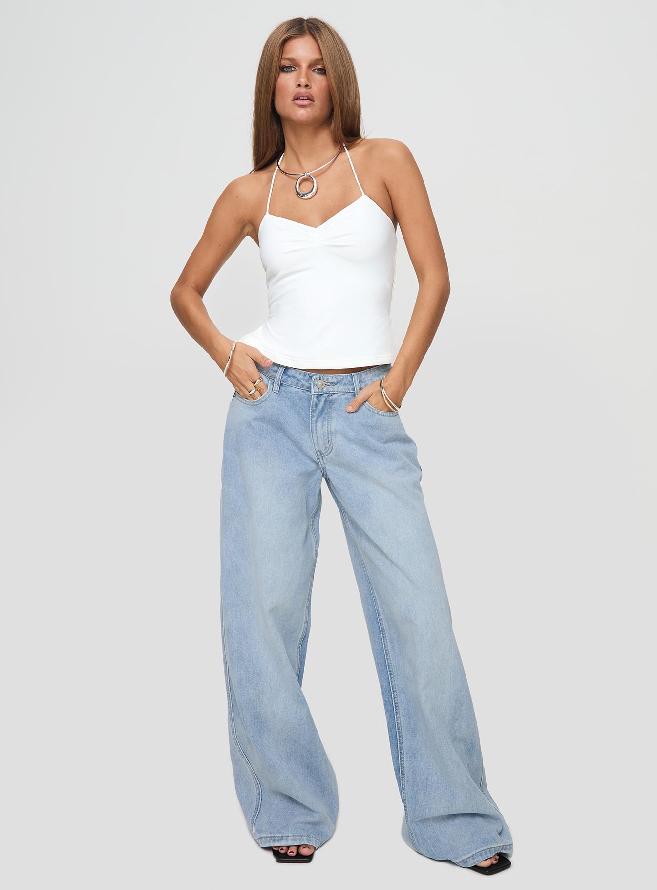 front view of model wearing Princess Polly Rehna Halter Top White Sleeveless V-Neck 