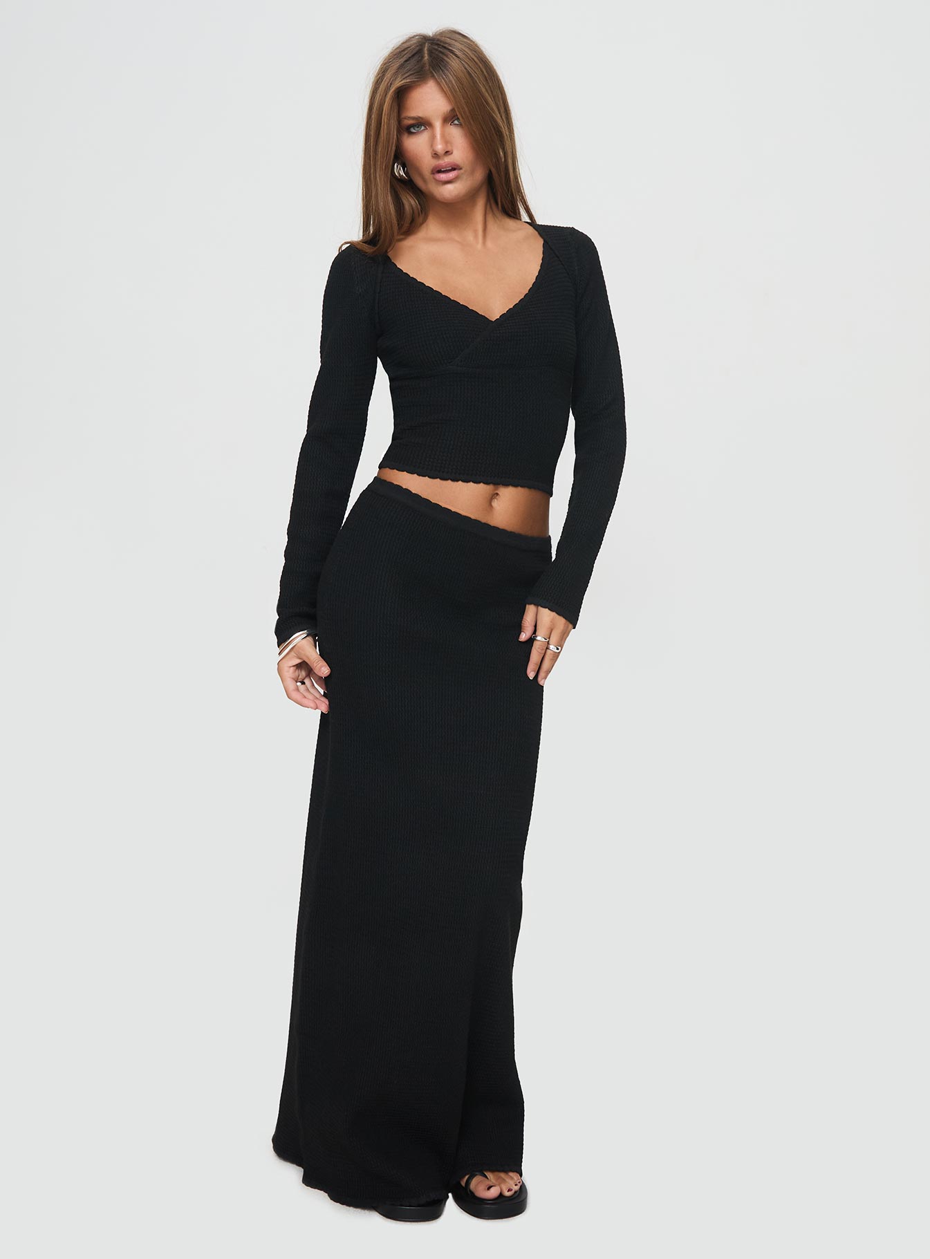 back view of model wearing Princess Polly Memi Long Sleeve Top Black Full Sleeves V-Neck 