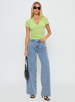 side view of model wearing Princess Polly Darla Low Rise Straight Jean Vintage Blue Wash Low Rise Jeans 