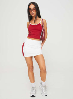 front view of model wearing Princess Polly Tex Skort White / Red 