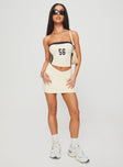   front view of model wearing Princess Polly Team Mini Skirt Cream Mini Skirts 