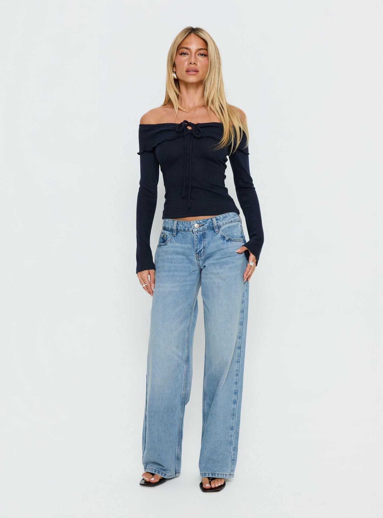 front view of model wearing Princess Polly Ellanor Low Rise Slouch Denim Jean Washed Mid Blue Wash Low Rise Jeans 