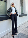 front view of model wearing Princess Polly Kinkirk Flared Pants Black Tall High Waisted Pants 