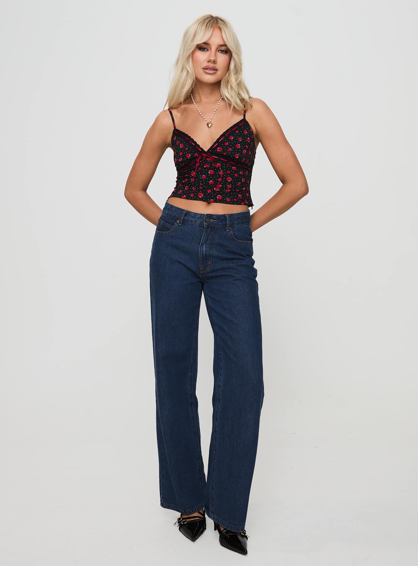 front view of model wearing Princess Polly Fondar Top Black Sleeveless Plunger 