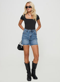 front view of model wearing Princess Polly Hayelle Denim Shorts Mid Blue High Waisted Shorts 