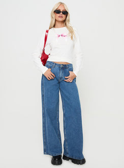 front view of model wearing Princess Polly Bow Baby Long Sleeve Top White Full Sleeves Full Sleeves Crew Neck Crew Neck 