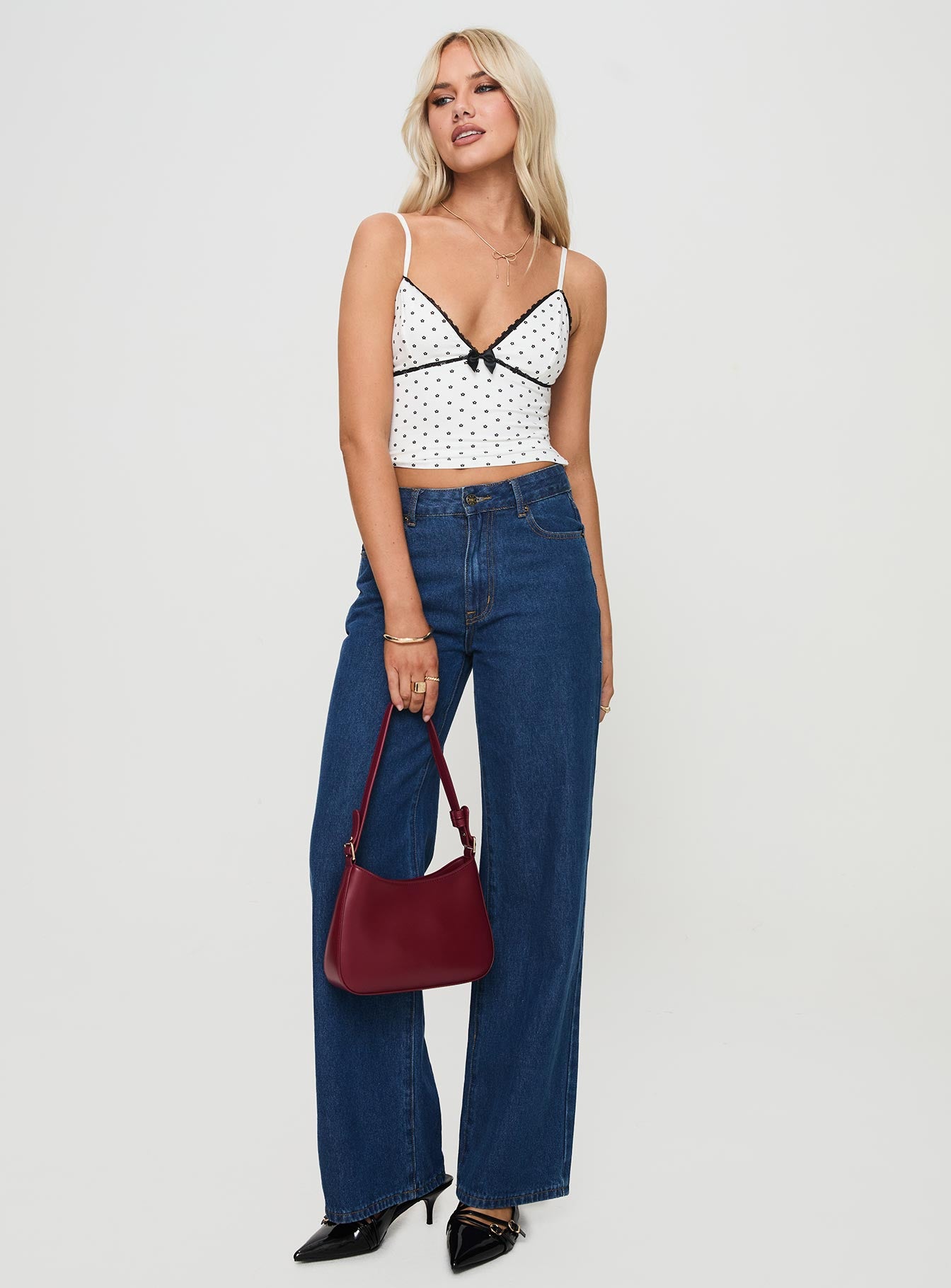 front view of model wearing Princess Polly Rune Top White / Black Sleeveless Plunger 