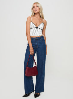 front view of model wearing Princess Polly Rune Top White / Black Sleeveless Plunger 