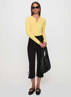 side view of model wearing Princess Polly Kerra Long Sleeve Bodysuit Lemon Full Sleeves 