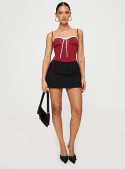 side view of model wearing Princess Polly Damsel Bodysuit Burgundy Sleeveless Sweetheart 