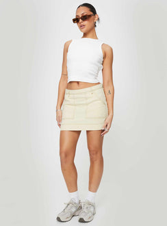   side view of model wearing Princess Polly Hughes Mini Skirt Cream Denim Mini Skirts 