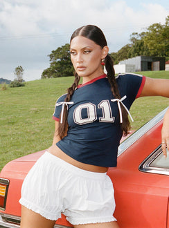 side view of model wearing Princess Polly Picu Shorts Poplin White Low Rise Shorts 