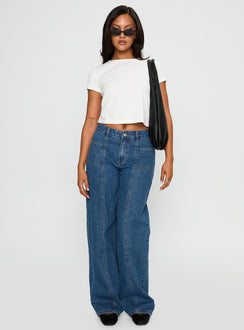 side view of model wearing Princess Polly Taji Wide Leg Jeans Dark Blue Mid Rise 