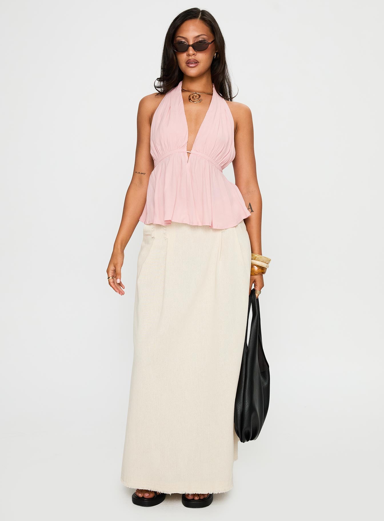 back view of model wearing Princess Polly Saddler Halter Top Pink Sleeveless Plunger 