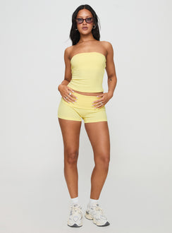 front view of model wearing Princess Polly Baseline Low Rise Rib Shorts Yellow Low Rise Shorts 