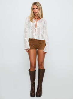 side view of model wearing Princess Polly Mine For Life Crochet Long Sleeve Top White Full Sleeves Crew Neck 