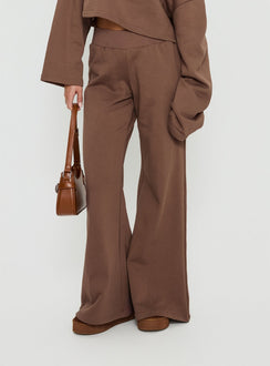 side view of model wearing Princess Polly Peaks Flared Track Pants Cocoa Mid Rise Pants 