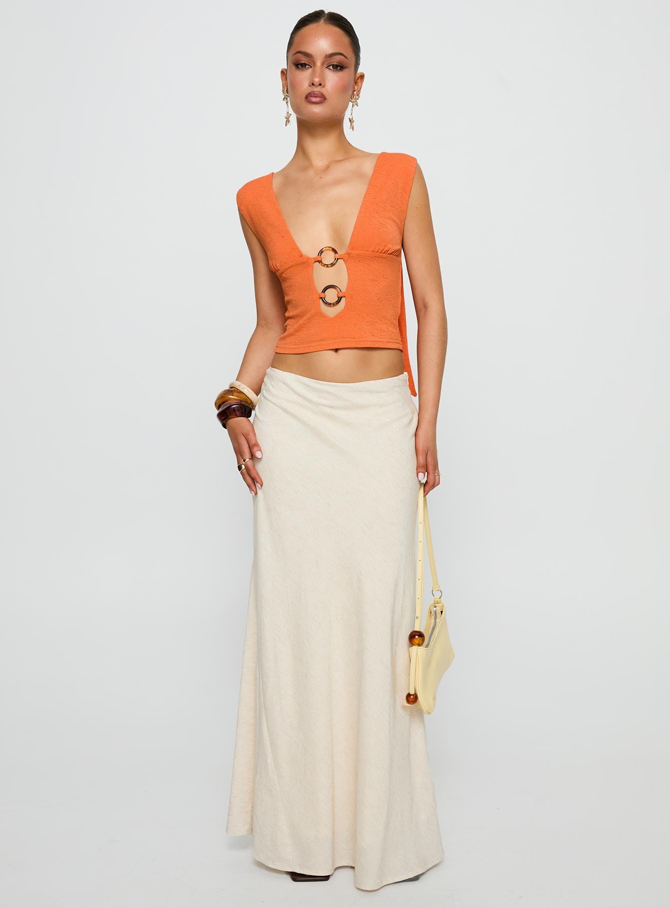 front view of model wearing Princess Polly Steward Top Orange Sleeveless Plunger 
