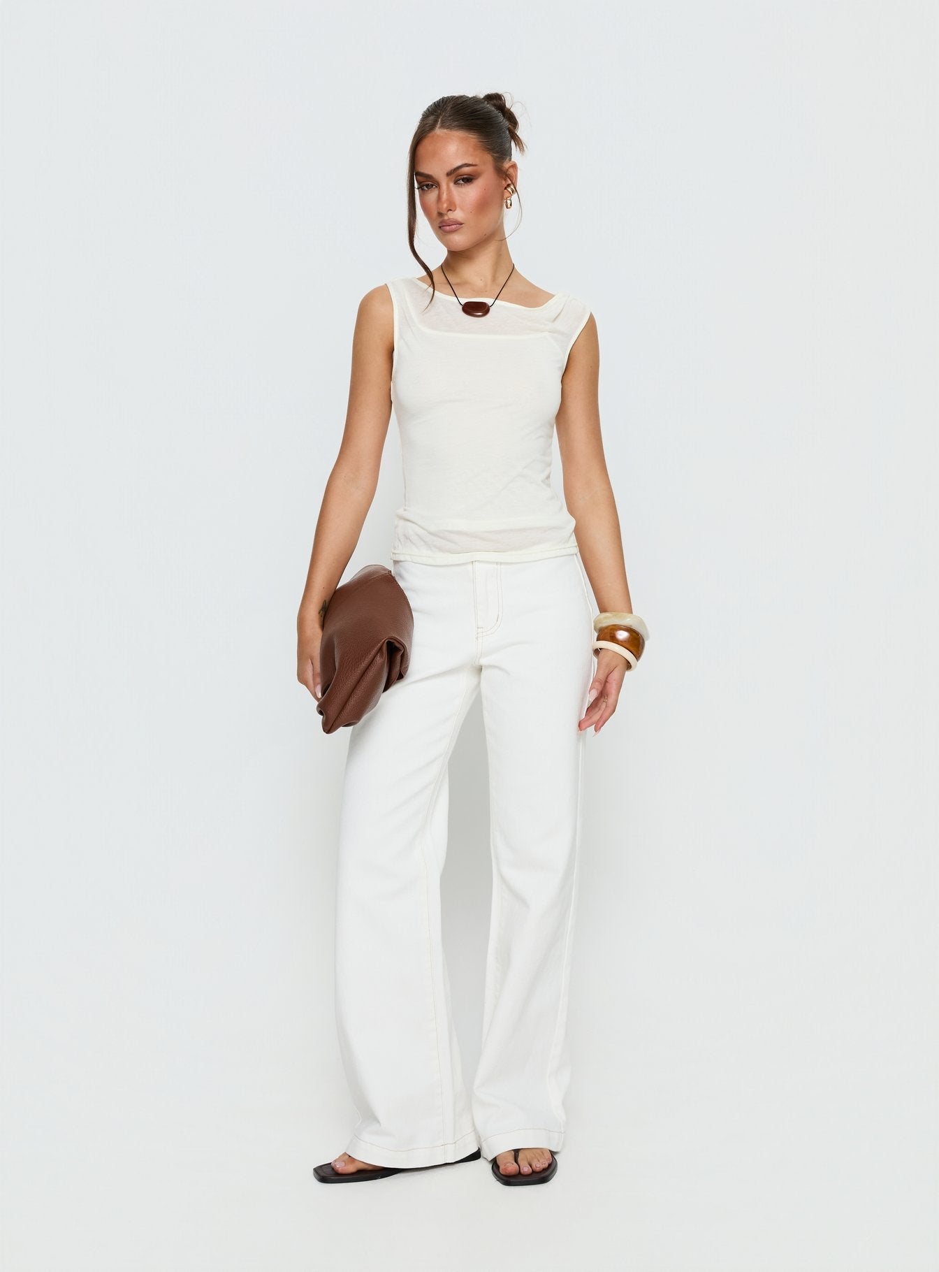 front view of model wearing Princess Polly Buenos No Waist Low Rise Straight Leg Jeans White Mid Rise Jeans 