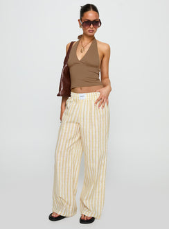 front view of model wearing Princess Polly Beach House Pants Yellow Stripe High Waisted Pants 