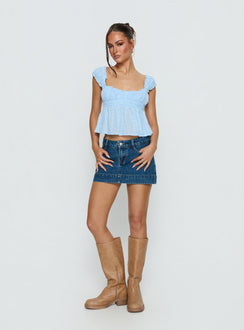   front view of model wearing Princess Polly Warna Low Rise Denim Mini Skirt Mid Blue Wash Mini Skirts 