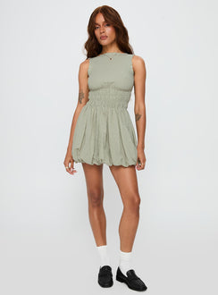 side view of model wearing Princess Polly Vittoria Bubble Hem Mini Dress Sage High Neck 