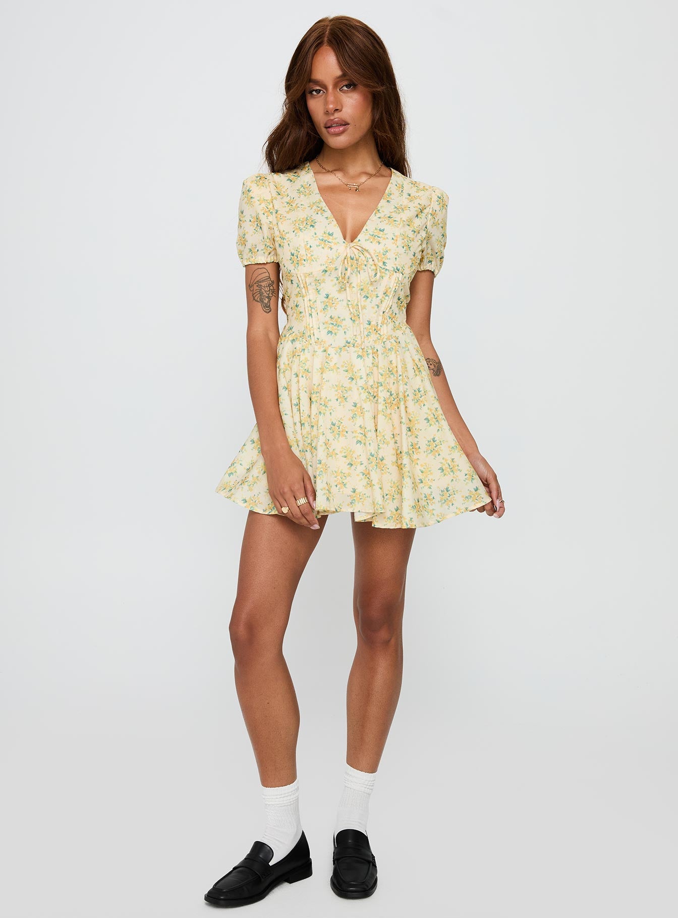 front view of model wearing Princess Polly Ethelyn Mini Dress Yellow Floral V-Neck 