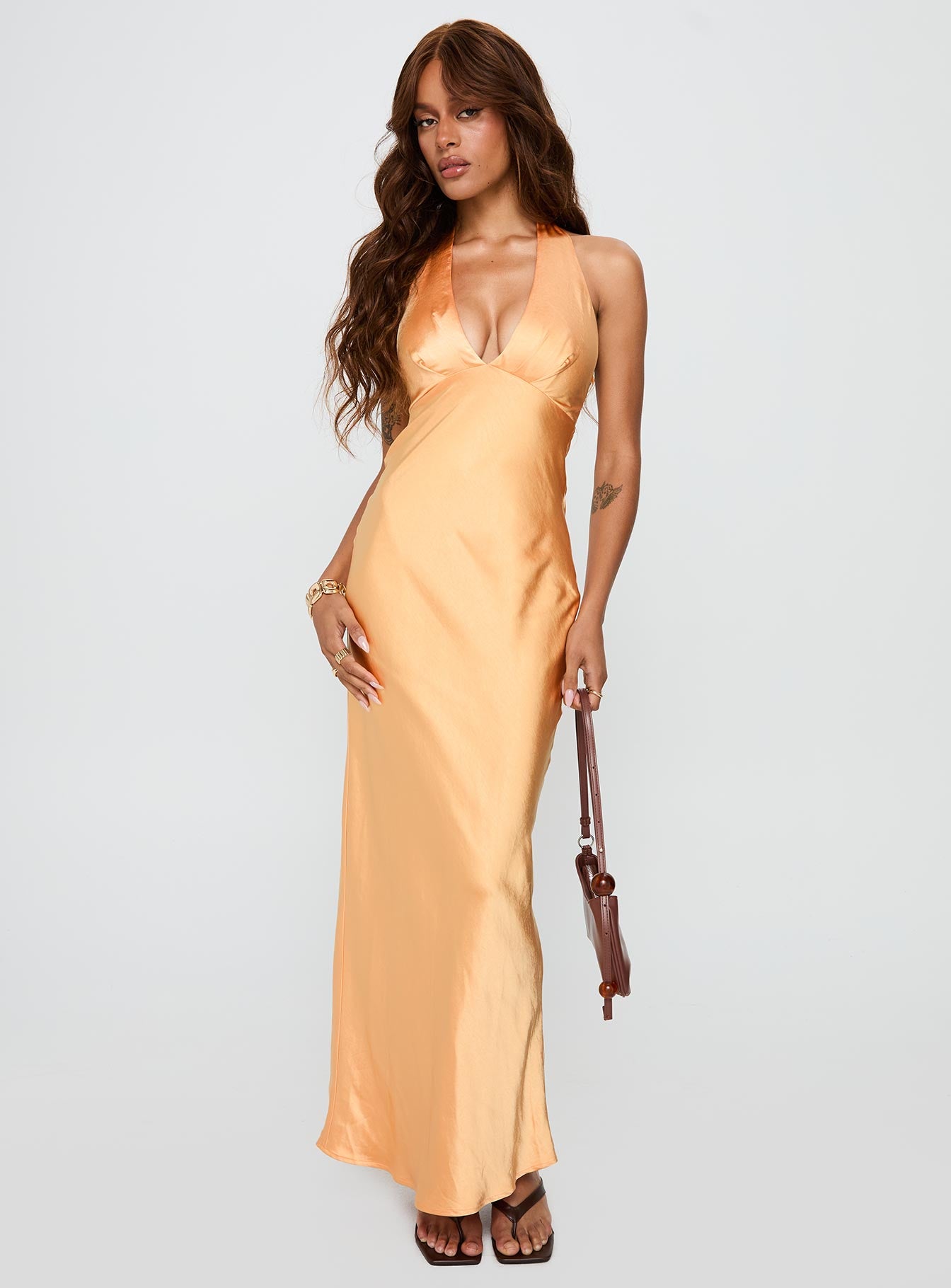 side view of model wearing Princess Polly Good For You Halter Maxi Dress Orange Plunger 