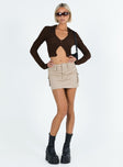 Brown long sleeve top Popcorn puff material  Classic collar  V neckline  Button front fastening 