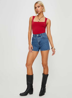 Mid-wash denim shorts High rise, belt looped waist, zip and button fastening, five pockets,  branded patch at back Non-stretch material, unlined 