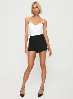 front view of model wearing Princess Polly Corella Bodysuit White Sleeveless Sweetheart 