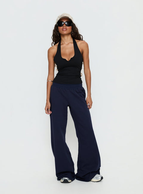 front view of model wearing Princess Polly Summits Flared Track Pants Navy Mid Rise Pants 