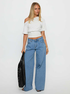 front view of model wearing Princess Polly Supercut Low Rise Baggy Pleat Jeans Light Blue Wash Low Rise Jeans 