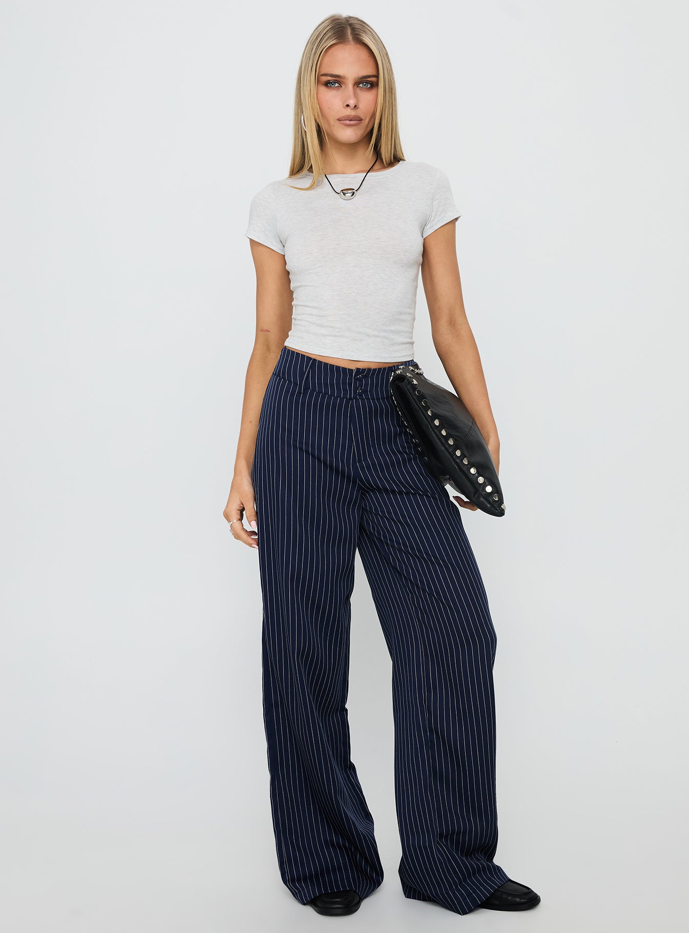 front view of model wearing Princess Polly Lorenne Mid Rise Pant Navy Pinstripe High Waisted Pants 