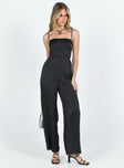 Jumpsuit Silky material Adjustable shoulder straps Lace up back Invisible zip fastening at back Wide leg