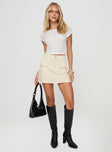 front view of model wearing Princess Polly Cadern Skort Cream High Waisted Shorts 