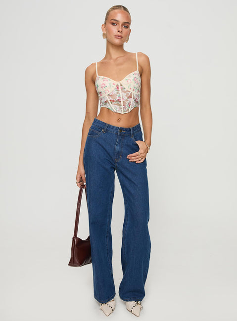 front view of model wearing Princess Polly Romania Top Cream / Floral Sleeveless Sweetheart 