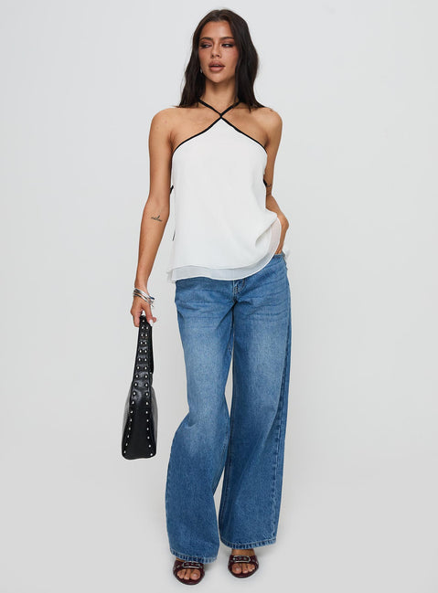 front view of model wearing Princess Polly Rafaella Halter Top Cream Sleeveless Asymmetric Neckline 