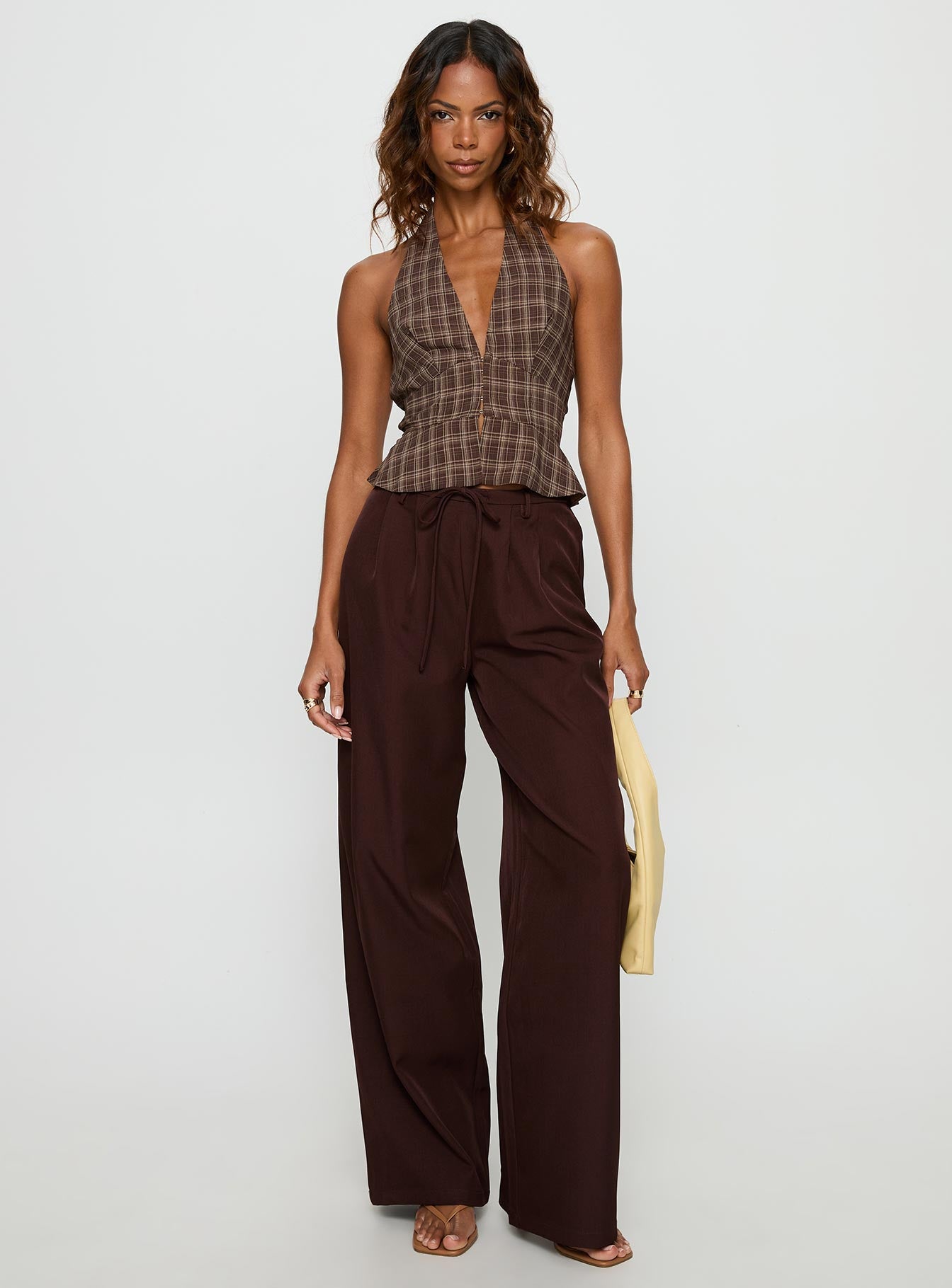 front view of model wearing Princess Polly Idolised Pleated Tie Waist Pant Chocolate Brown Mid Rise Pants 